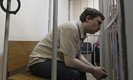 Mikhail Kosenko during a court hearing in May 2013. A judge found him guilty despite video footage showing that he had tried to move away from a scuffle in which a riot policeman was struck. Photograph: Maxim Shemetov/Reuters