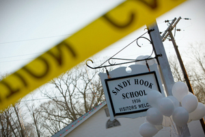 Balloons hang from the Sandy Hook Elementary School sign in Sandy Hook, in Newtown,